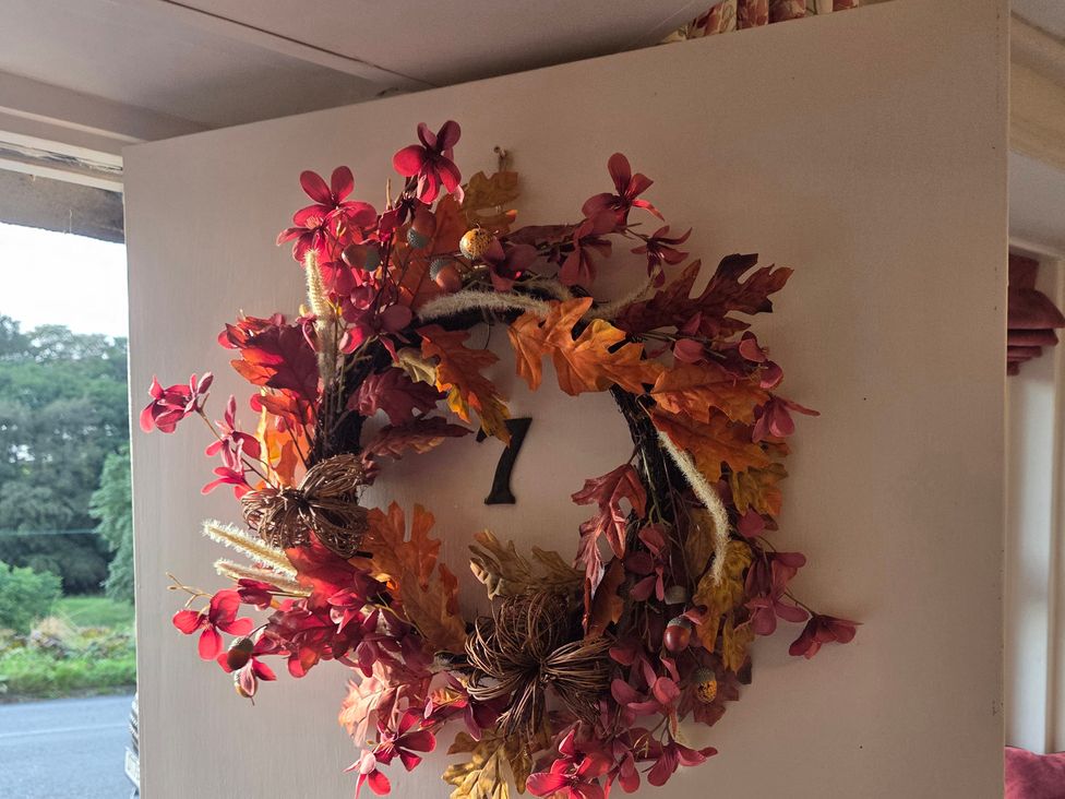 A decorative wreath with number 7 in an entryway at Willow Wood in Langcliffe near Settle