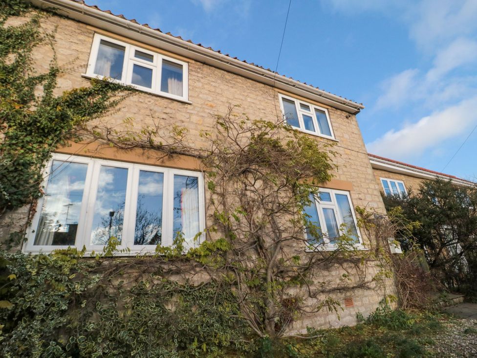 An exterior view of a house with windows and ivy at St. Anthonys in York