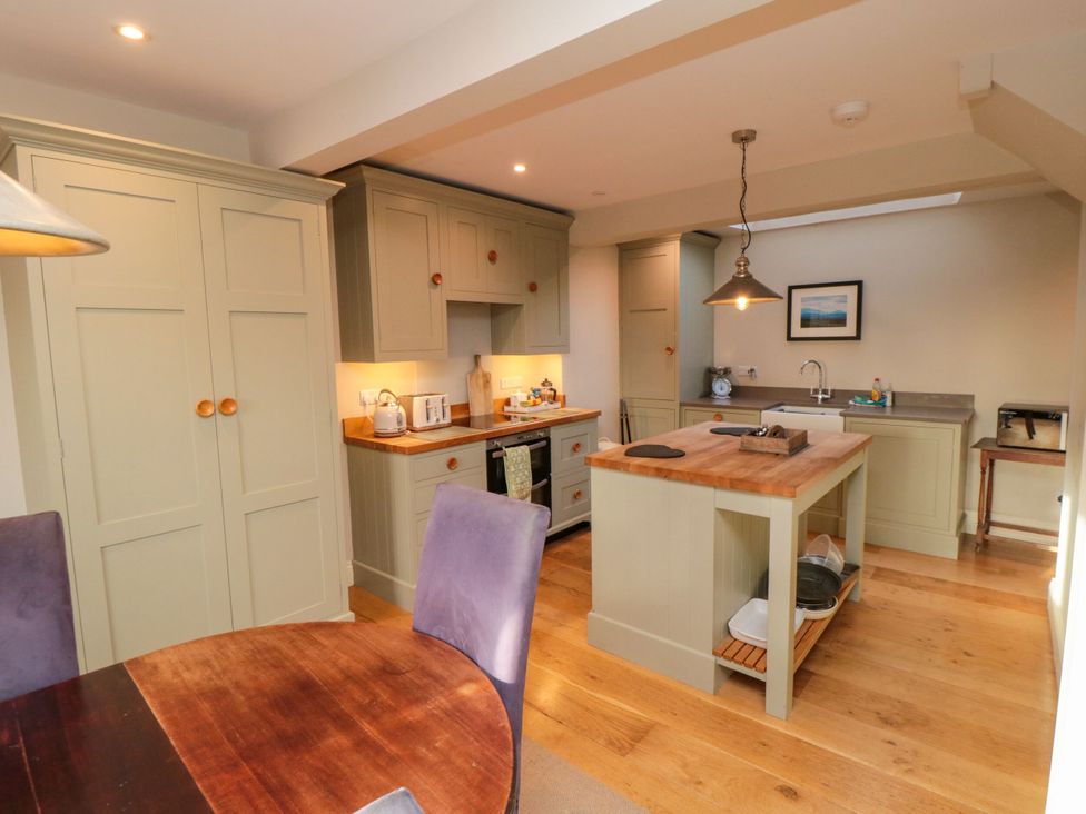 A kitchen with an island and sink at St. Anthonys in York