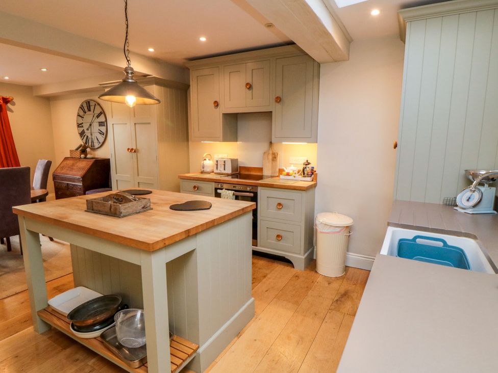 A kitchen with an island and cabinetry at St. Anthonys York