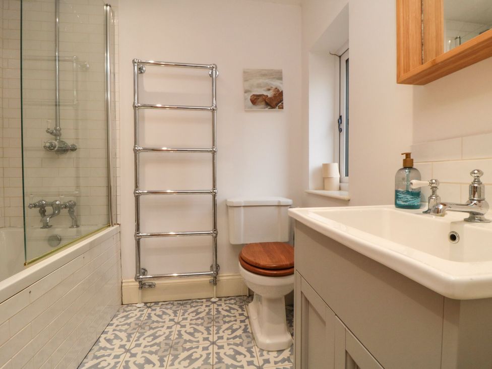 A bathroom with a bathtub and sink at St. Anthonys in York