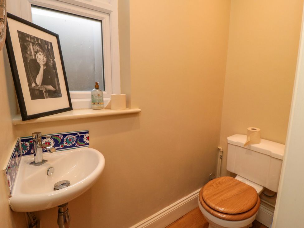 A bathroom with a toilet and sink at St. Anthonys in York