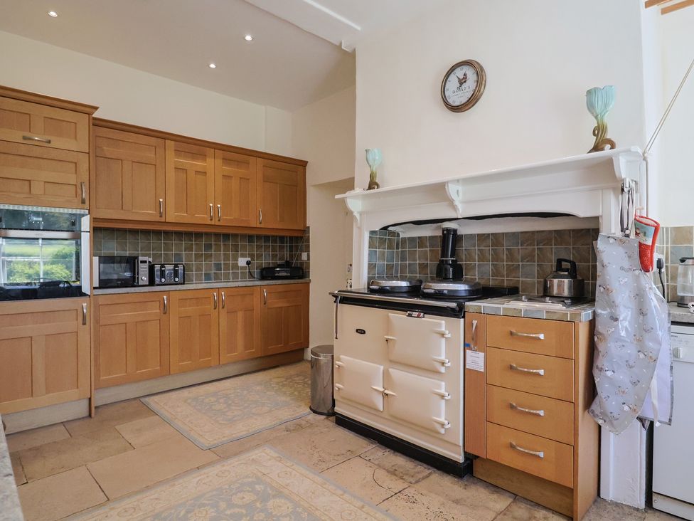 A kitchen with cabinets and an oven at Goulds Farmhouse in Milborne St Andrew