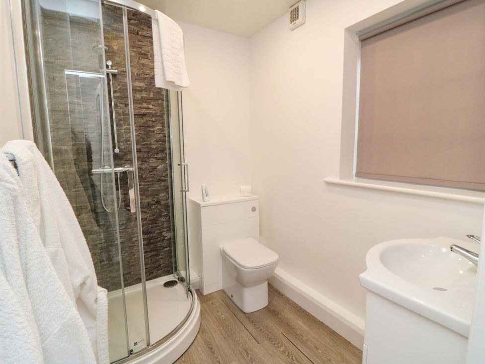 A bathroom with a shower and sink at Tooth Suite in Yarm