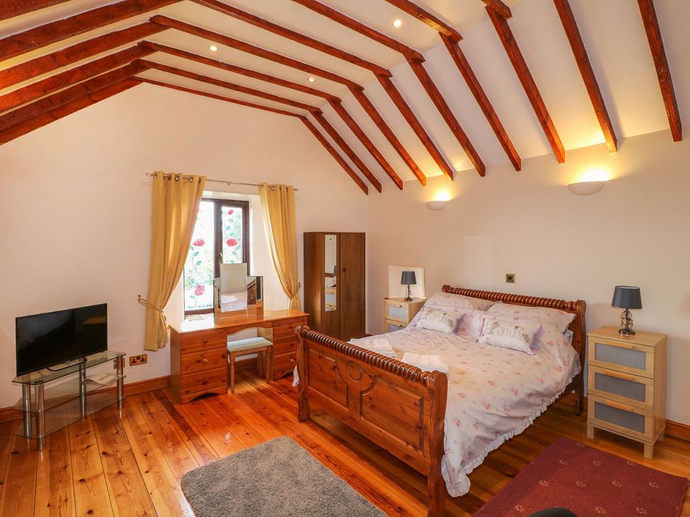 A bedroom with a bed and television at Riber View Barn Chesterfield