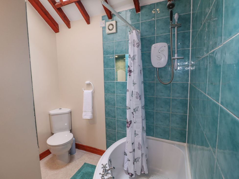 A bathroom with shower and bathtub at Riber View Barn Chesterfield
