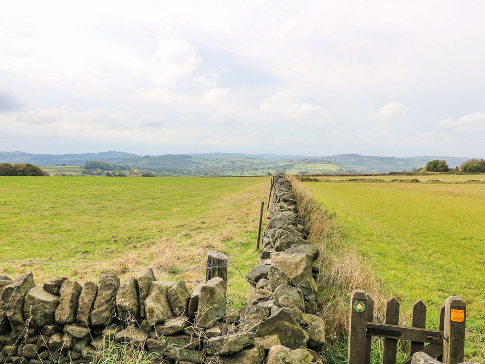 A field with a stone wall and gate at Riber View Barn Chesterfield