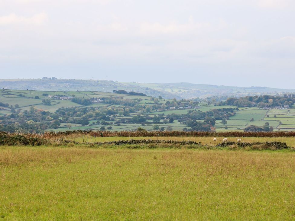 View of fields and hills with sheep in Riber View Barn Chesterfield