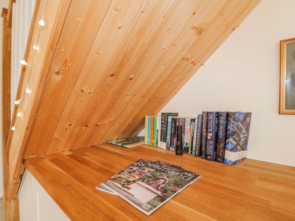 A study area with books and a magazine at America Lodge in Oakham
