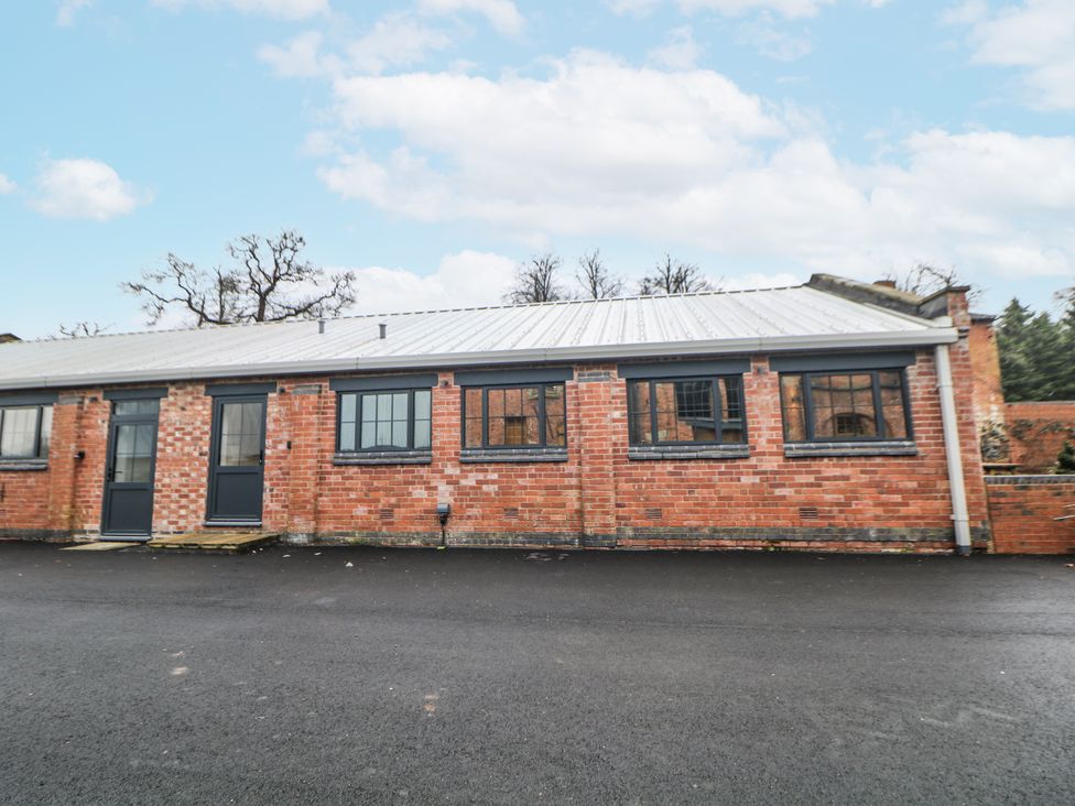 A building exterior featuring windows and a door at Courtyard View in Ashbourne