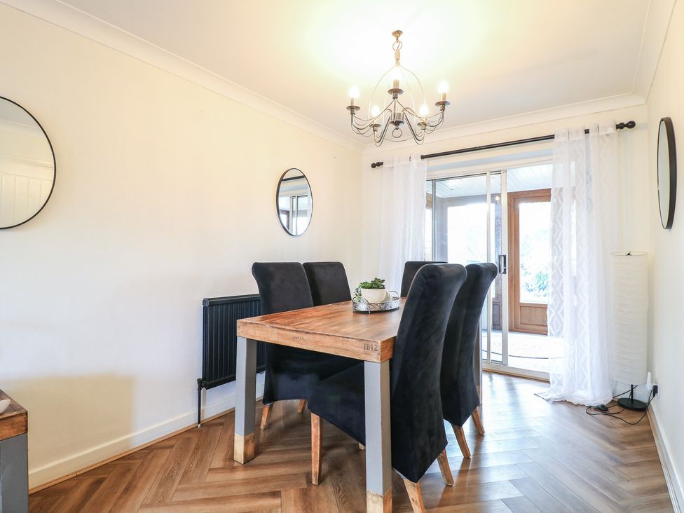 A dining room with a table and chairs at 57 Howden Avenue Doncaster