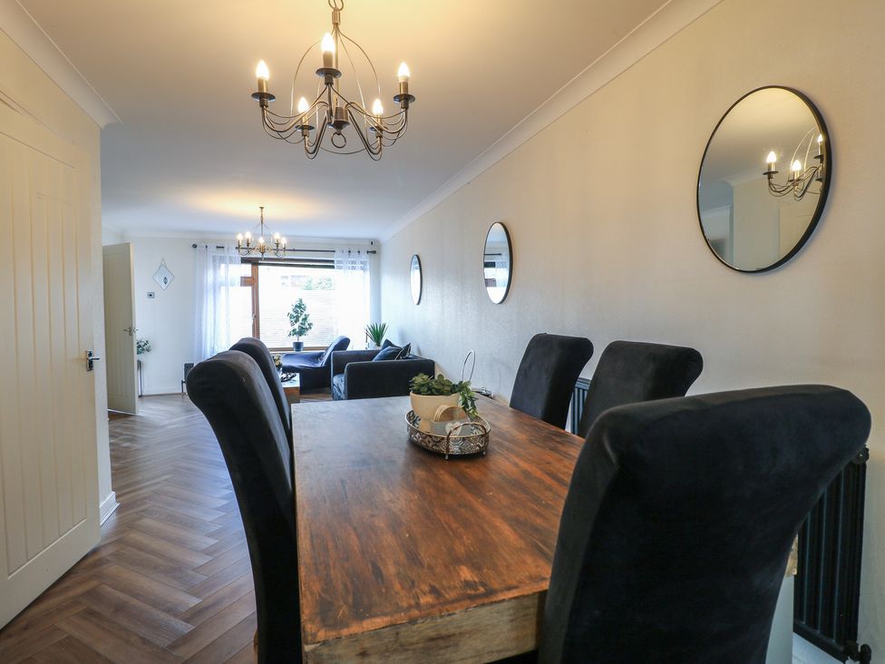 A dining room with a table and chairs at 57 Howden Avenue Doncaster