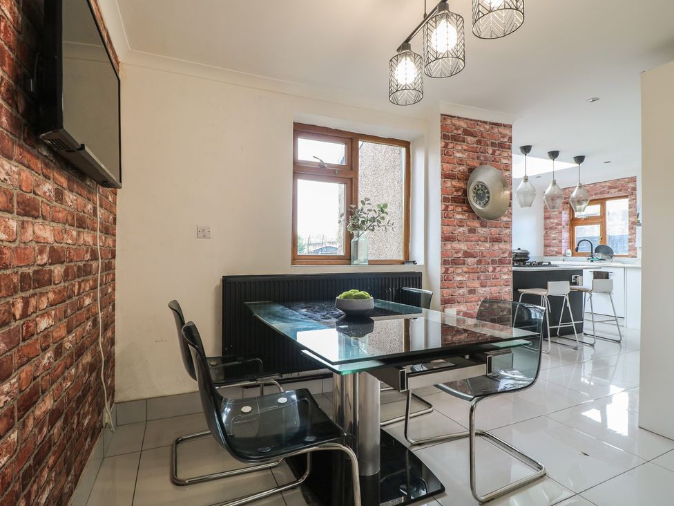A dining area with a table and chairs at 57 Howden Avenue in Doncaster