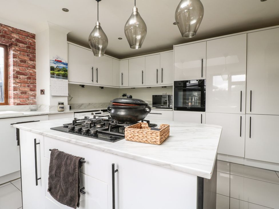 A kitchen with a stove and cabinets at 57 Howden Avenue in Doncaster
