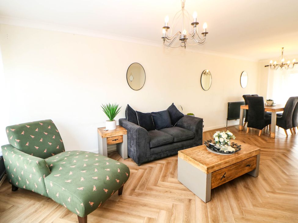 A living room with a sofa and chaise lounge at 57 Howden Avenue, Skellow