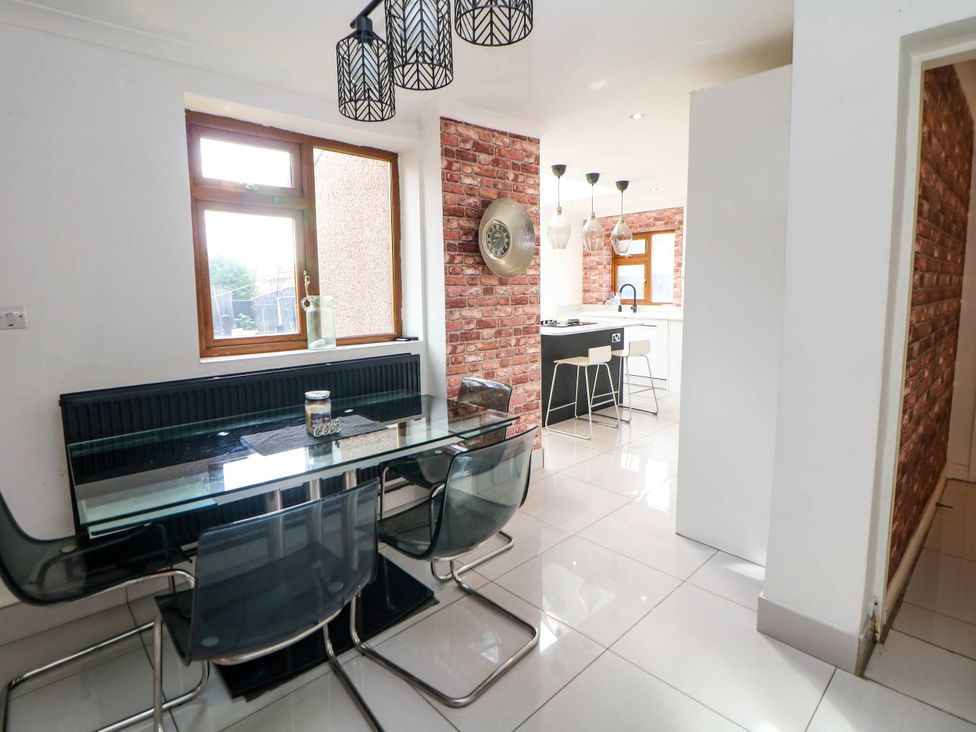 A dining room with a table and chairs at 57 Howden Avenue Skellow
