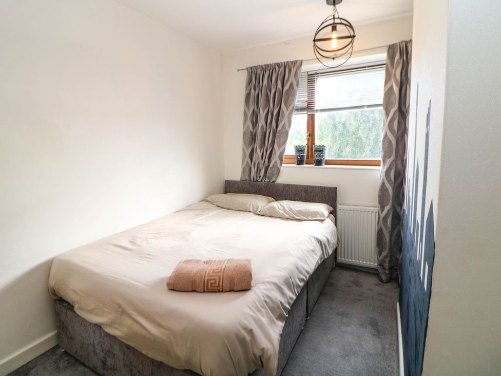 A bedroom with a bed and window at 57 Howden Avenue in Skellow
