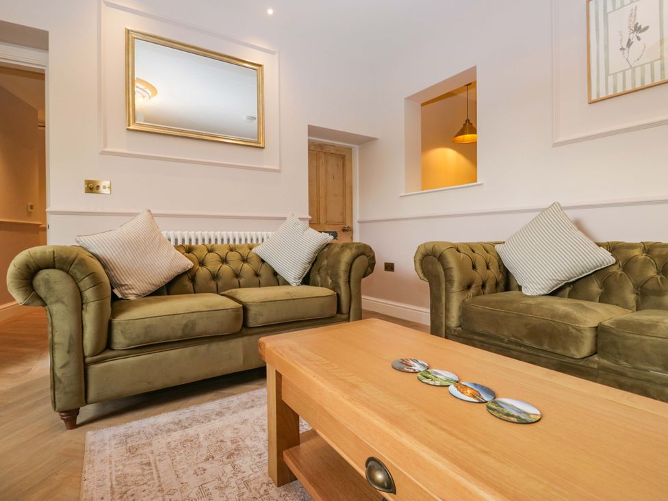 A living room with two sofas and a coffee table at Flat 5 Caxton House Windermere
