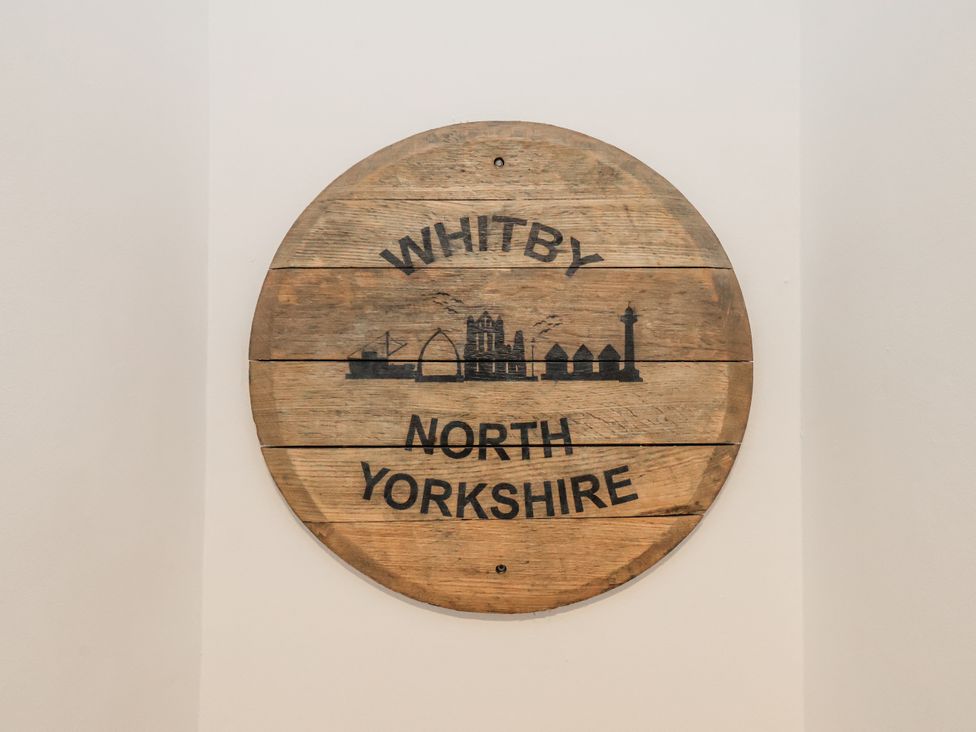 A wooden sign with Whitby and North Yorkshire at Albion Cottage Whitby