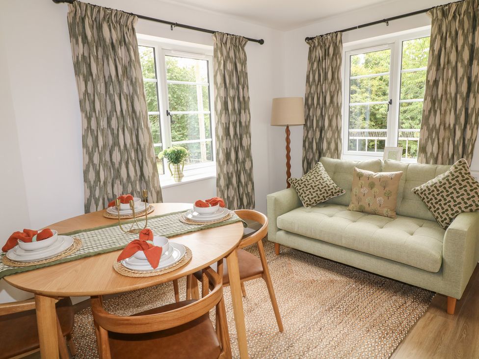 A dining room with table set for a meal at Casthorpe Lodge Cottage Barrowby