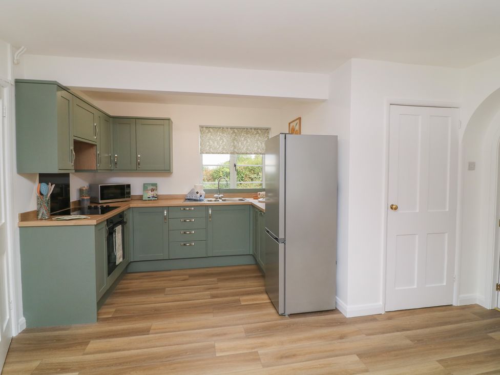 A kitchen with cabinets and appliances at Casthorpe Lodge Cottage Barrowby