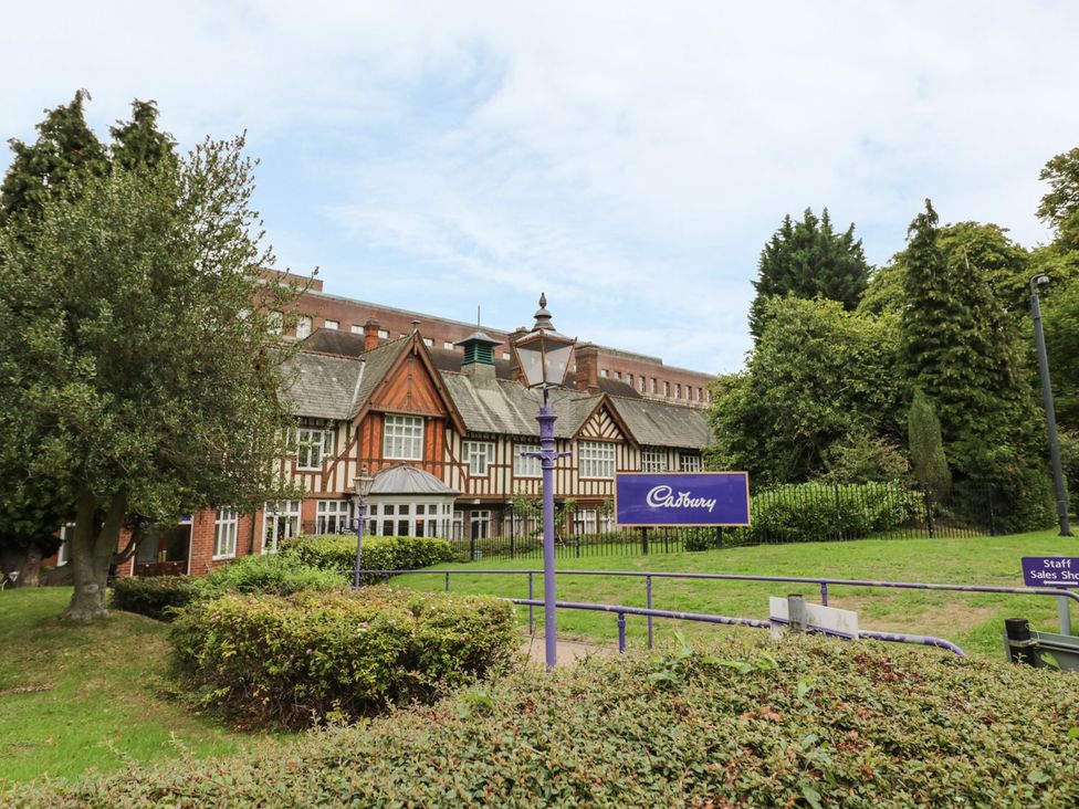 A building with a sign and lamp post at Cadbury in an outdoor area