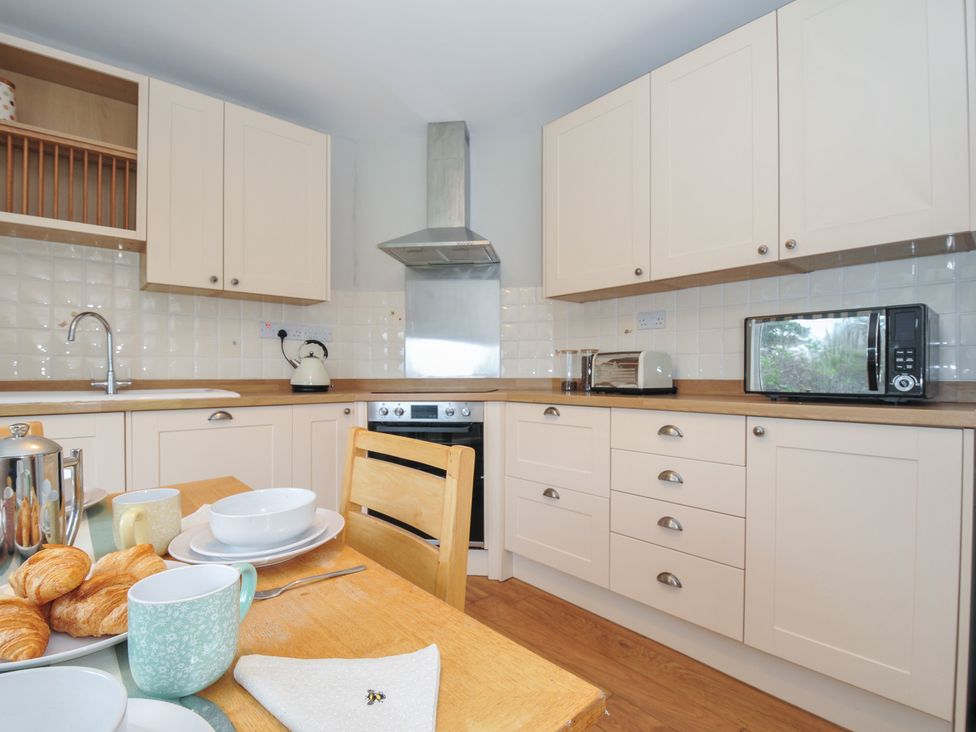 A kitchen with breakfast items on the table at 4 Polgrain Turning in St. Wenn near St Columb Major