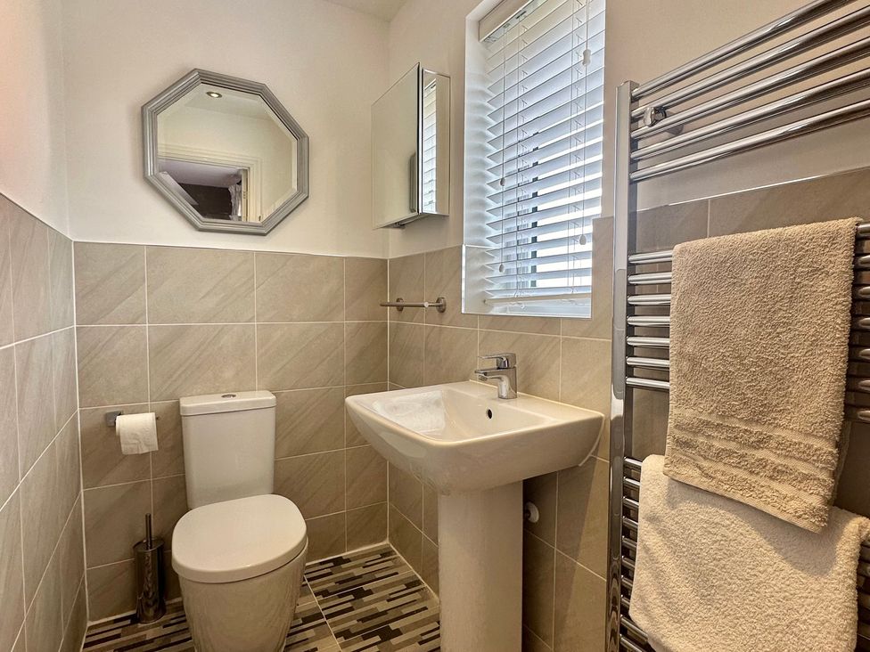 A bathroom with a sink and toilet at 2 Clarke Close in Cottenham