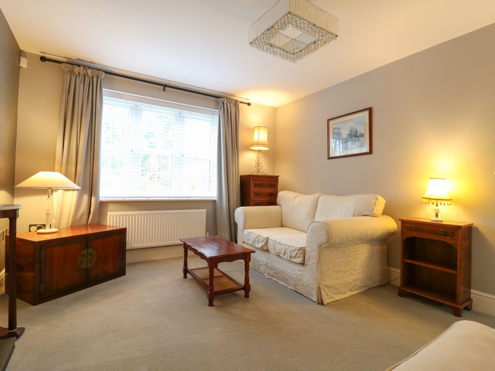 A living room with a sofa and coffee table at 2 Clarke Close in Cottenham