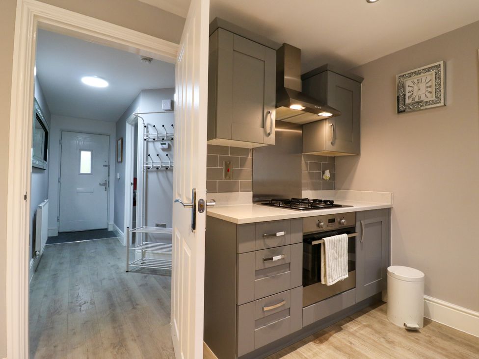 A kitchen with stove and oven at 2 Clarke Close in Cottenham