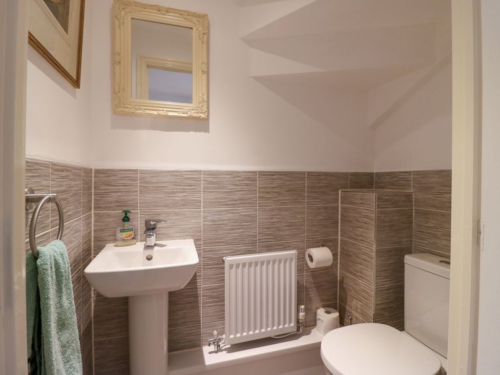 A bathroom with a sink and toilet at 2 Clarke Close Cottenham