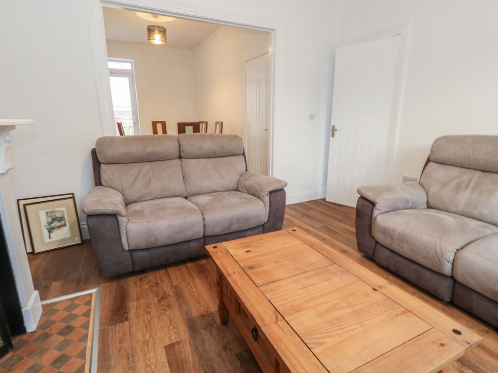A living room with a sofa and coffee table at 93 Abbotsbury Road in Weymouth