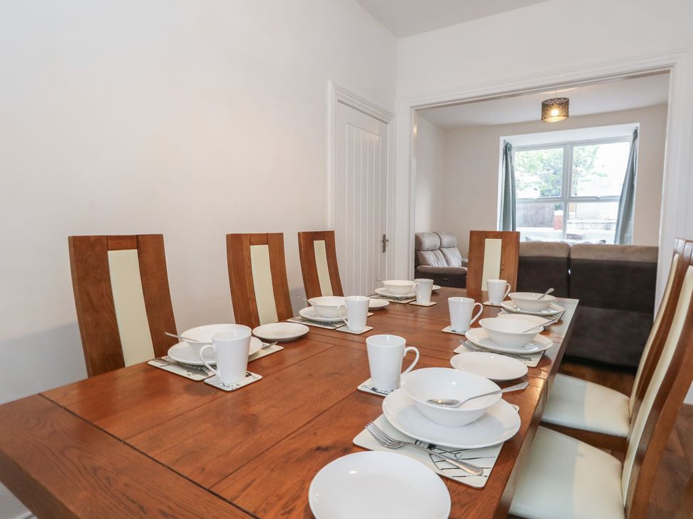 A dining room setup with table and chairs at 93 Abbotsbury Road in Weymouth