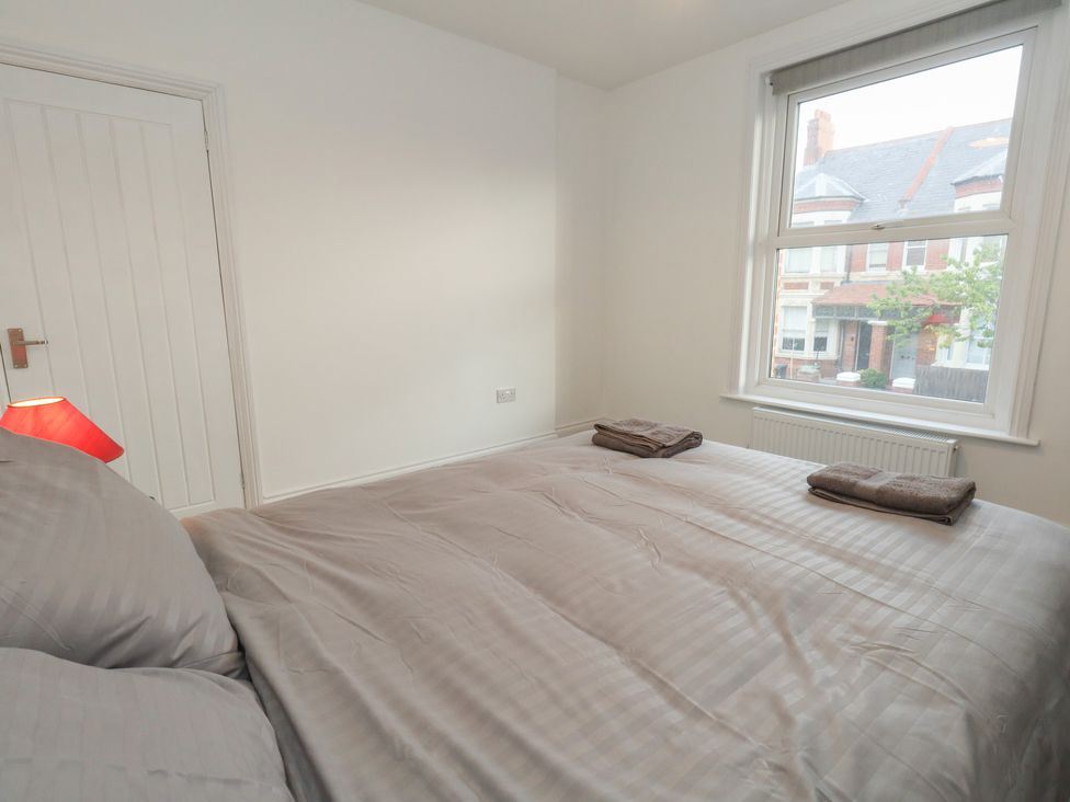 A bedroom with a bed and window at 93 Abbotsbury Road in Weymouth
