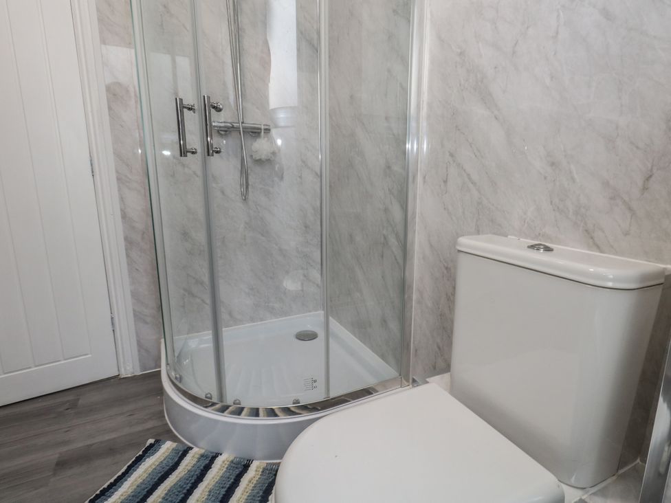 A bathroom with a shower and toilet at 93 Abbotsbury Road Weymouth
