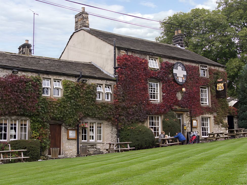 An outdoor area with a pub and seating at Town Head Farm in Skipton
