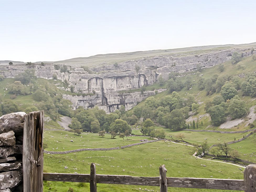 A landscape with cliffs and trees at Town Head Farm in Skipton