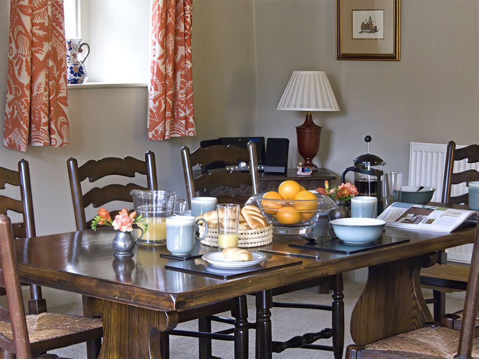 A dining room with a table set for breakfast at Town Head Farm in Skipton