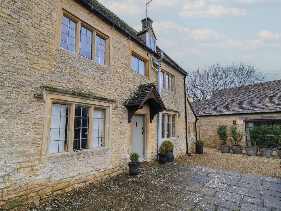 An outdoor view of a stone house with plants at The Smithy in Stow-On-The-Wold
