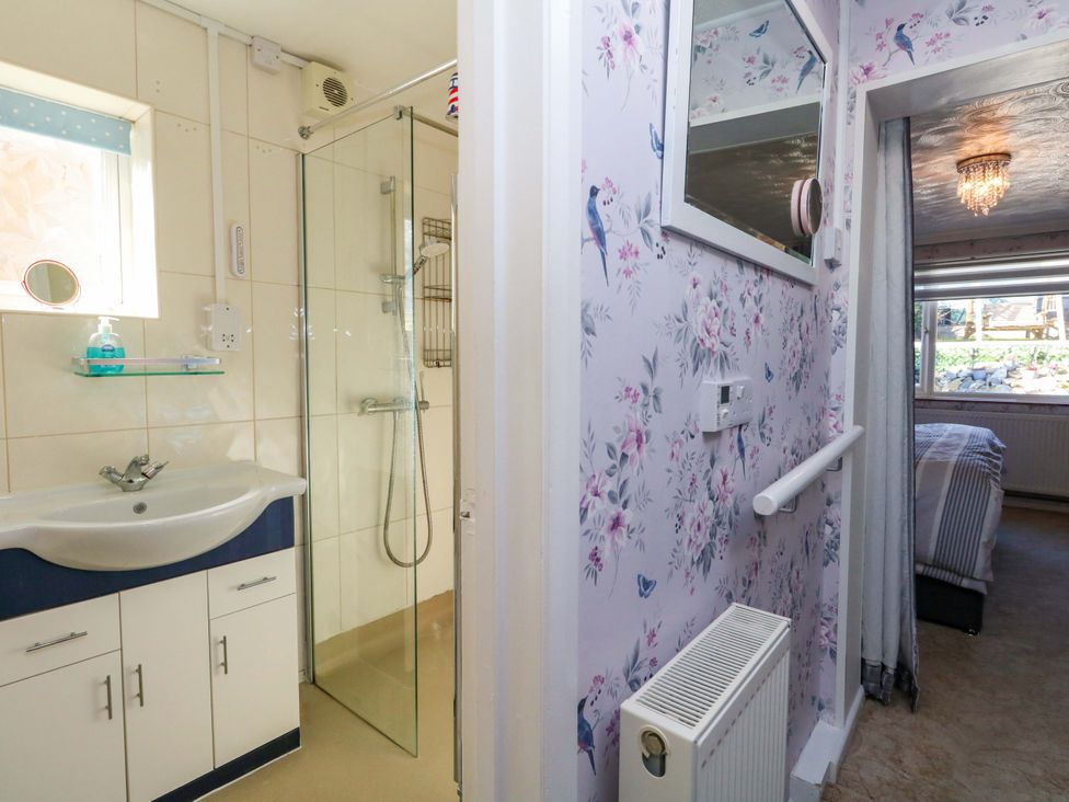 A bathroom with a sink and shower at 46 Chafeys Avenue