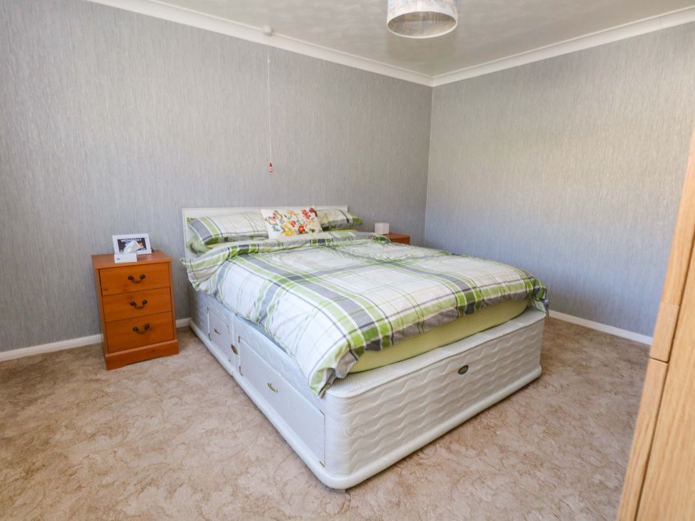 A bedroom with a bed and a nightstand at 46 Chafeys Avenue 