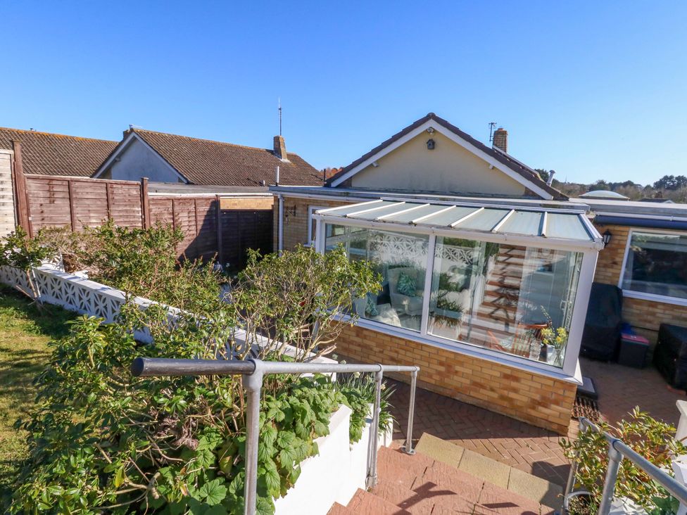 A garden with steps leading to a conservatory at 46 Chafeys Avenue 