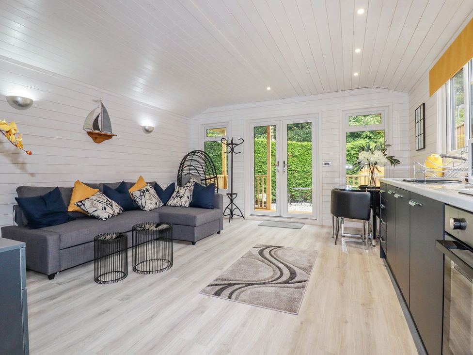 A living room with a sofa and coffee table at St. Chad's Lodge in Bodmin
