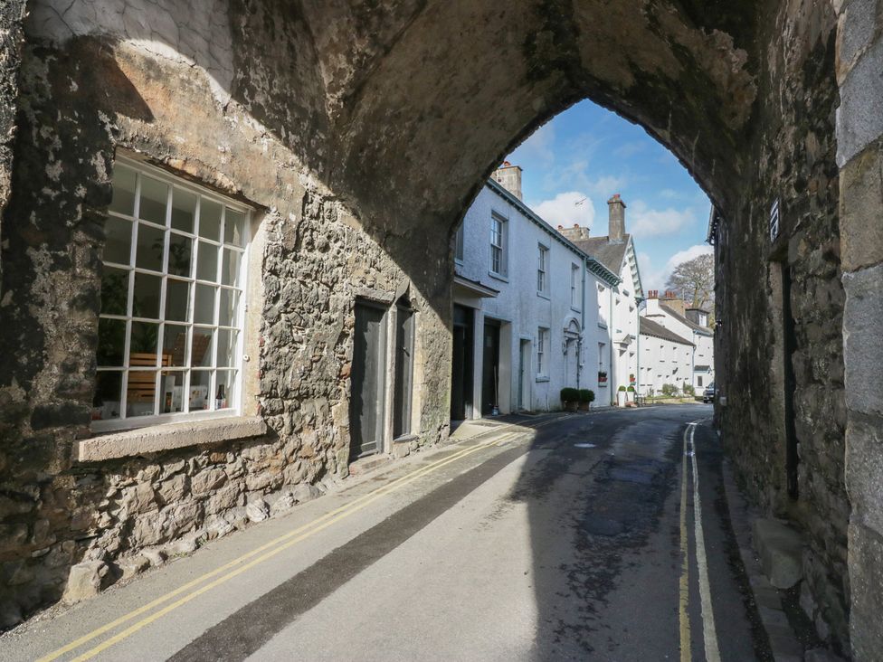 An outdoor view with a stone archway leading to a street at Flat 4 Tower House Grange-Over-Sands