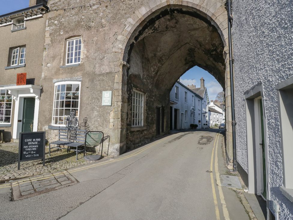 An archway with buildings and a street in the background at Flat 4 Tower House Grange-Over-Sands