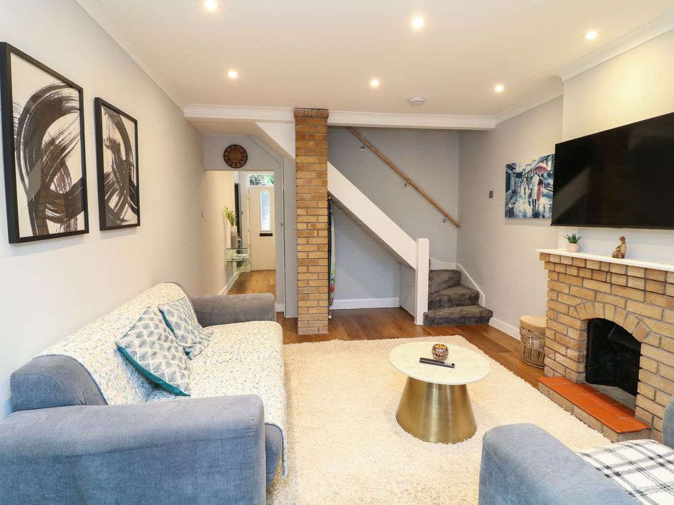A living room with a sofa and a coffee table at 11 Regent Street Melton Mowbray
