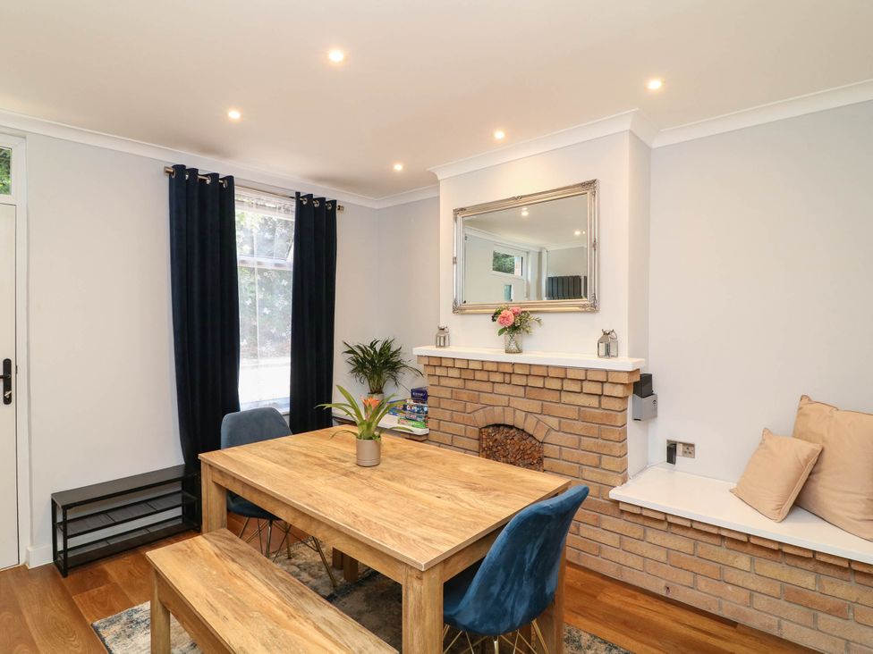 A dining room with a table and chairs at 11 Regent Street Melton Mowbray