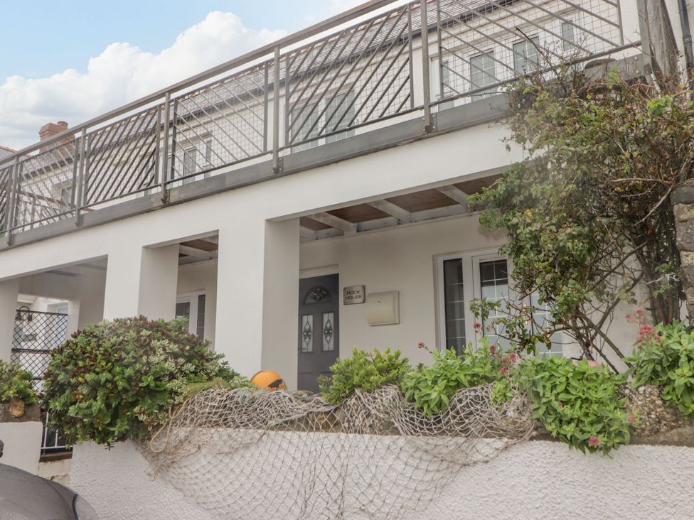 A house with a balcony and plants at Rock House in Narberth