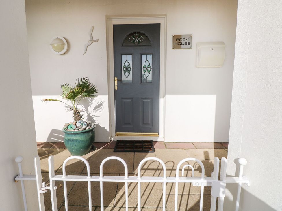 An entryway with a door and plant at Rock House in Narberth