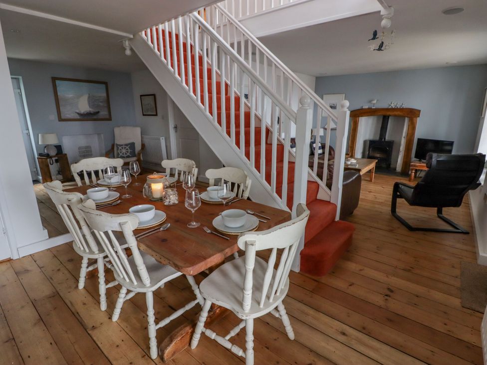 A dining room with a table set for dinner at Rock House in Narberth